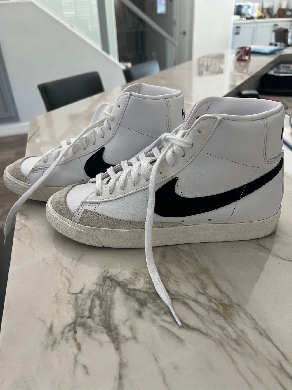 Nike White High-Top Sneakers with Black Swoosh